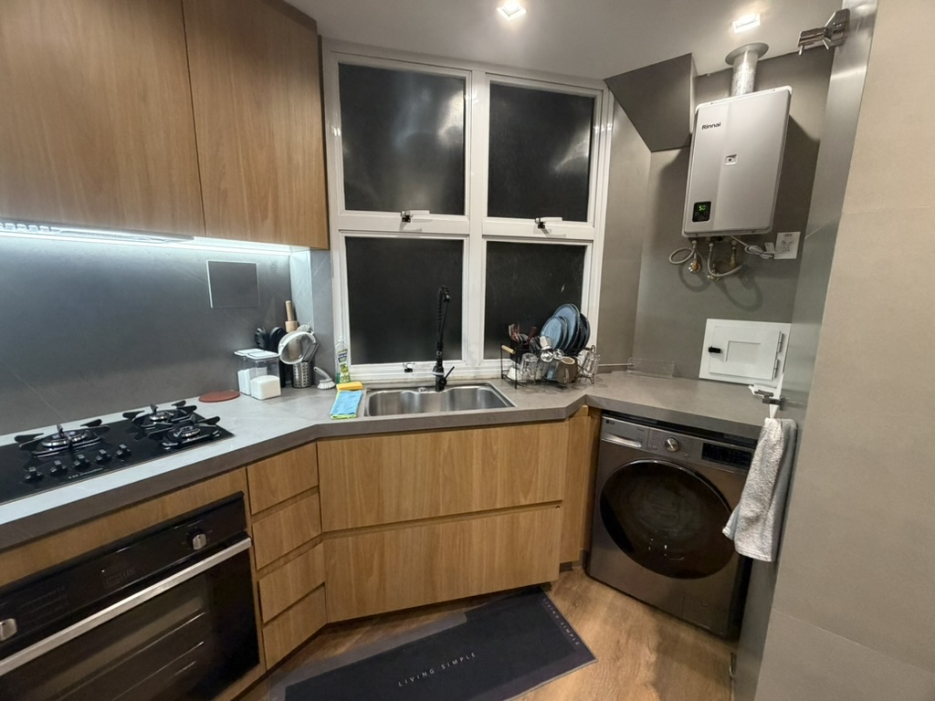 Kitchen sink and laundry side with washing machine